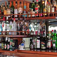 Why do people drink overpriced liquor in restaurants?